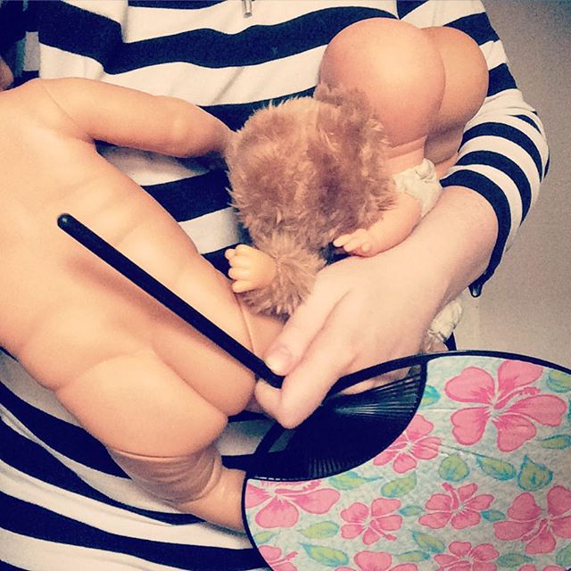 Dancing_to_the_sound_of_The_Rocky_Horror_Picture_Show__carrying_all_baby_dolls__the_hairy_one__too___while_simultaniously_making_wind_with_a_hand-held_fan._Whatever_this_kid_demands.__12von12